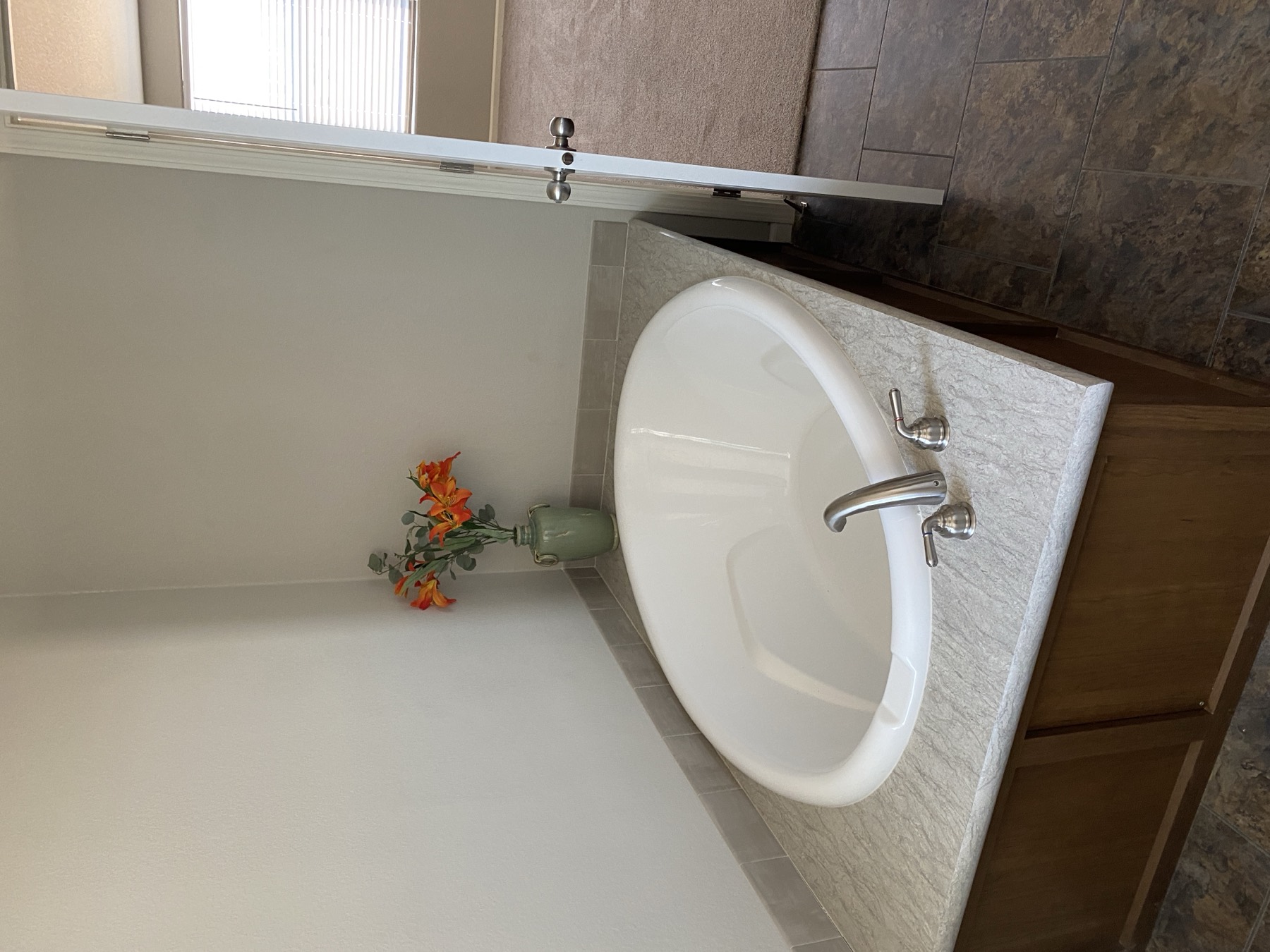 Garden tub with tile surround in the primary bathroom